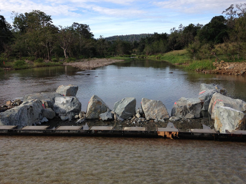 Commencement of fishway construction, with first wall and ridge rocks in place