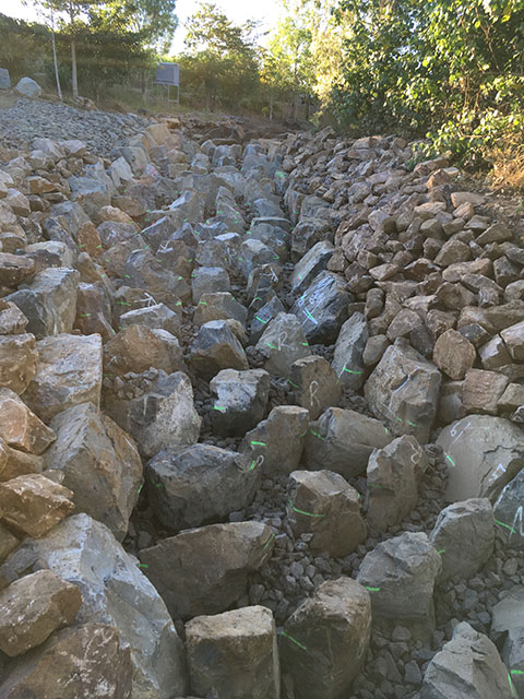 Rocks placed and height measurements visible upstream Bakers Creek